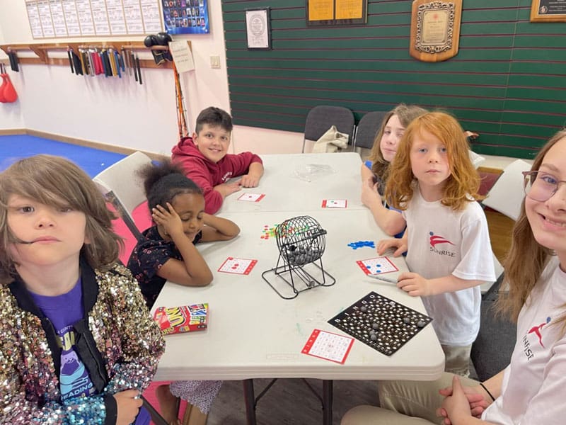Students breaking boards during a party class